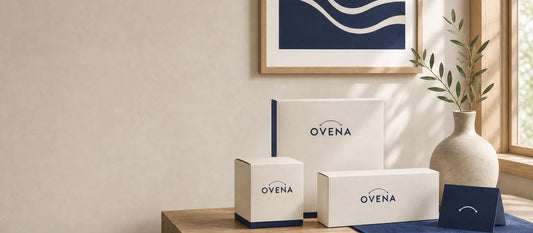 Three Ovena boxes styled with framed navy wave art
